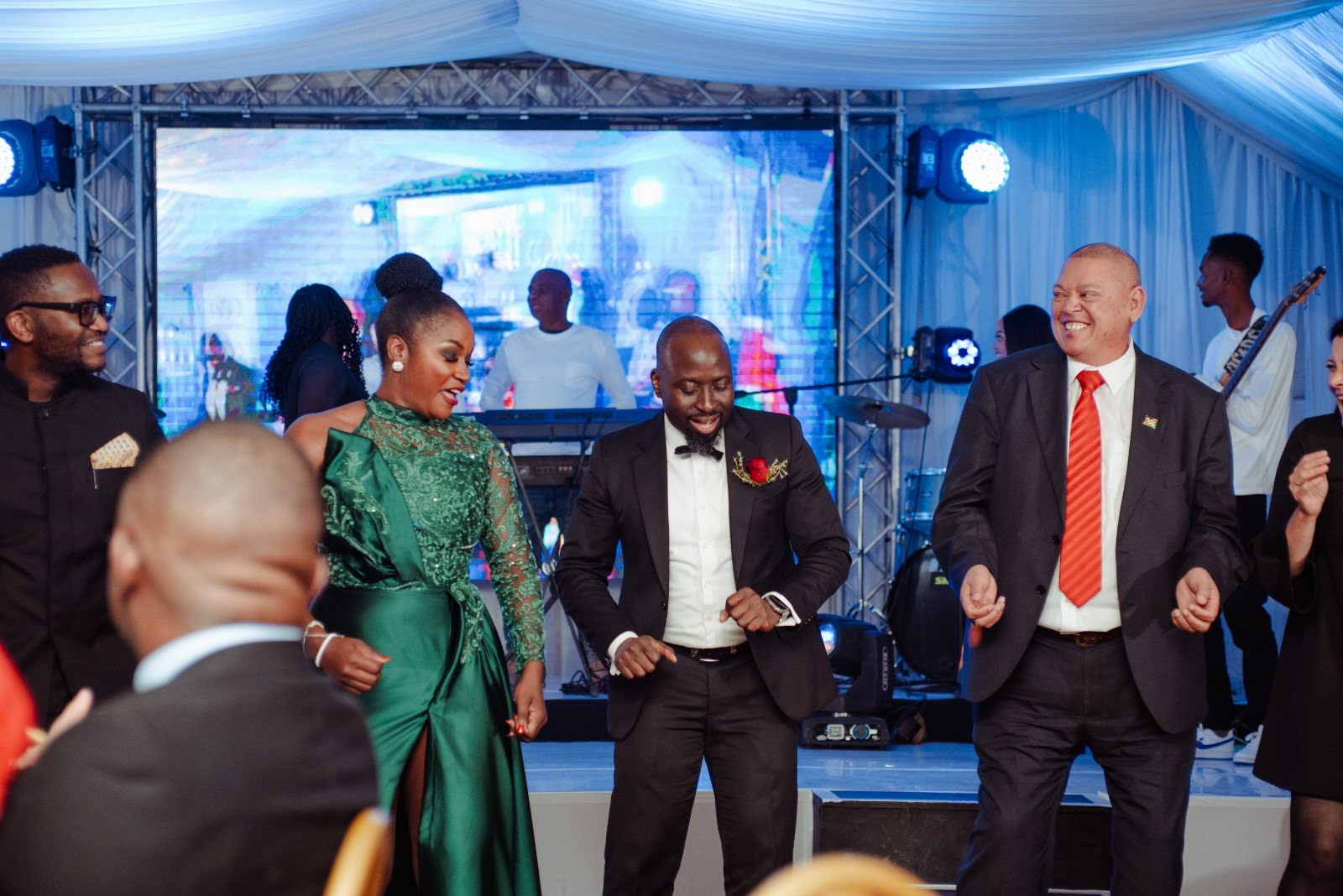 Lorraine Kondombolo engaging with guests during a gala celebration